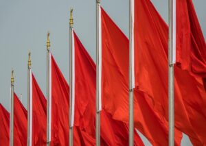 Row of red flags on poles